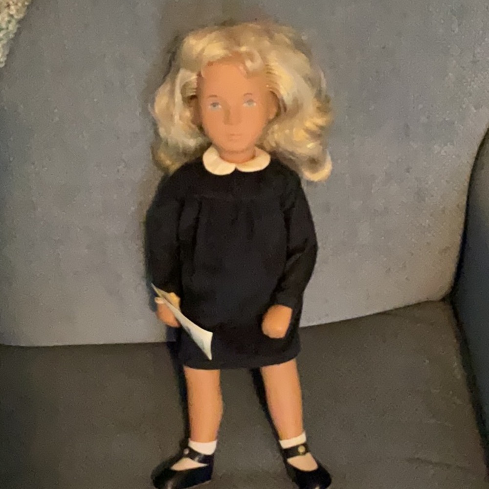 20 Years of Sasha Doll. Classic Black Dress Doll with Blonde Hair.